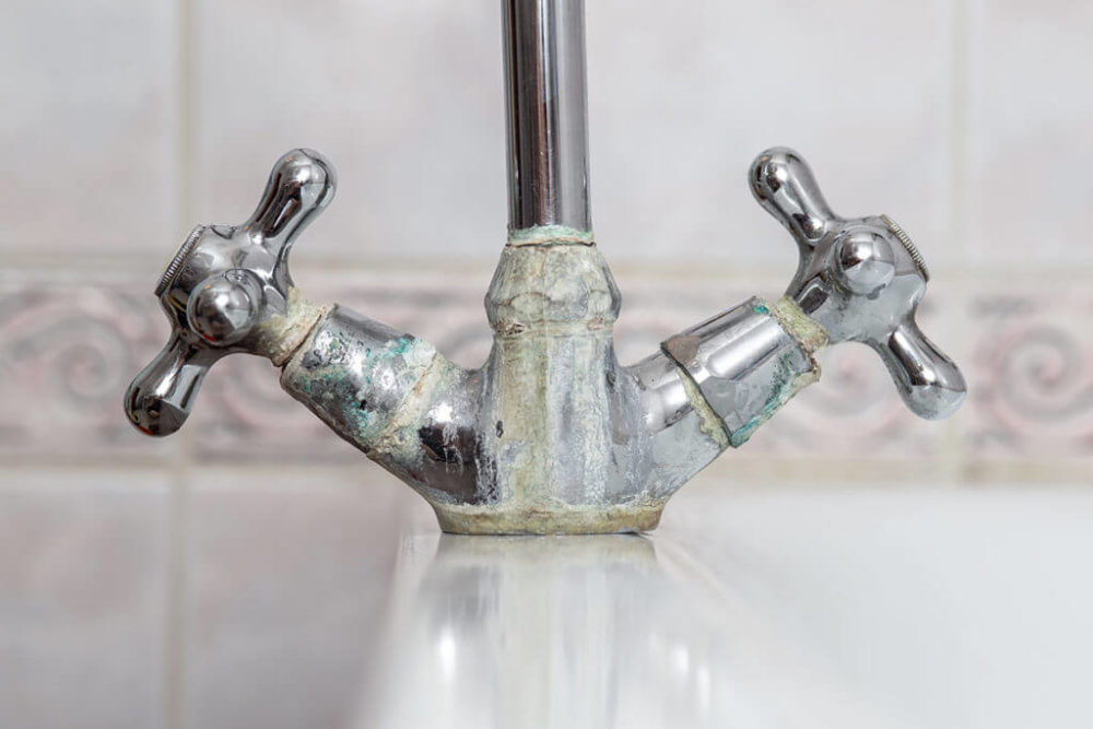 Hard water calcium buildup on faucet